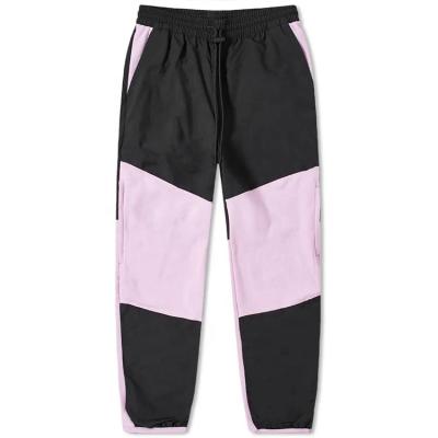 China Custom Made Anti-Wrinkle Men Track Colorblock Nylon Mens Elastic Waist Drawstring Pants Fleece Pants for sale