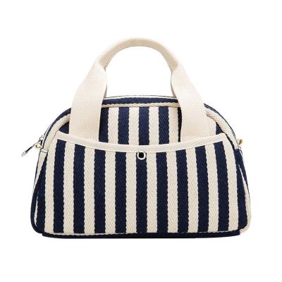 China Canvas cotton fashion blue and white striped yarn-dyed bag with thick black and white striped women's bag fabric bag artistic simple spirit for sale