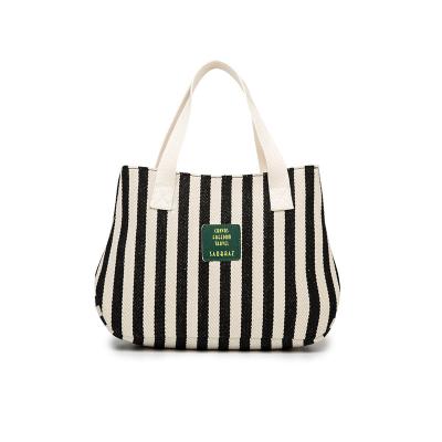 China Canvas cotton fashion blue and white striped yarn-dyed bag with thick black and white striped women's bag fabric bag artistic simple spirit for sale