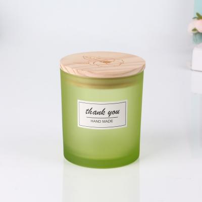 China Daily Life Home Stored Candle 10oz Cheap Green Glass Jar With Wooden Bamboo Lid for sale