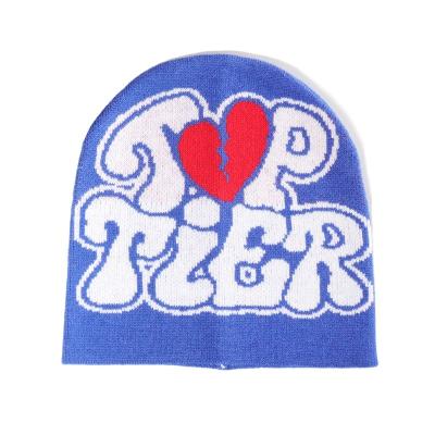 China COMMON Custom embroidered Logo Jacquard Patterns Football Fitted Free Knit Winter Beanie Hat with pom-poms for sale