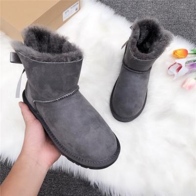 China Homecoming fashion trend fashion sheepskin women's boots with ribbon bow snowboots wool real leather boots for ladies in winter for sale