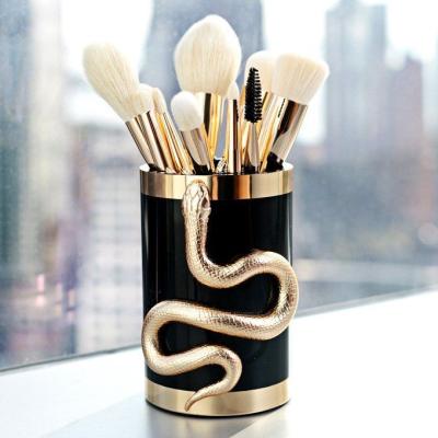 China Angular Blush Custom Makeup Brush Stereoscopic Snake Shape Gold 10pcs Handle Vegan Unique Luxury Synthetic White Hair Plastic for sale