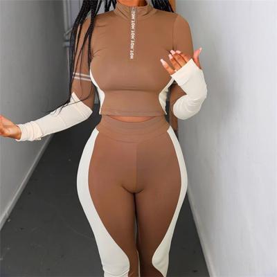 China Anti-pilling GHX1609 spring 2021 women outfits sexy joggling 2 piece patchwork tracksuit suit crop tops matching high waist gaiters set for sale