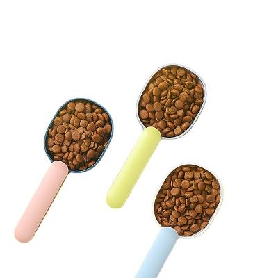 China Hot Selling Practical Automatic Pet Food Spoon Feeding Cat Dog Plastic Food Spoon Multicolor for sale