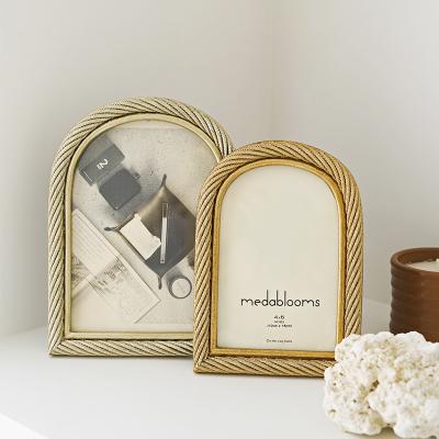 China Wholesale Home Decor Resin Gold Arch Photo Frame New for sale