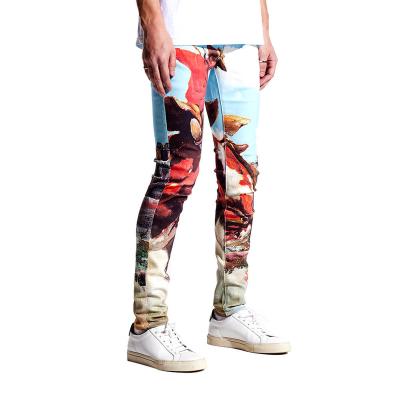 China Breathable compression pants ripped jeans hollow men streetstyle pants with graffiti pattern jeans for men patched jeans for sale