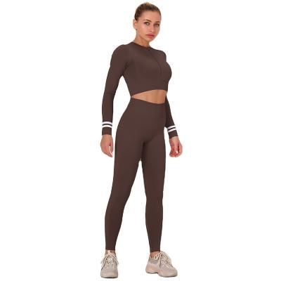 China New 2 Piece Yoga Legging Wear Set Seamless Hot Sale Design Breathable Tight Elastic Women With Zipper for sale