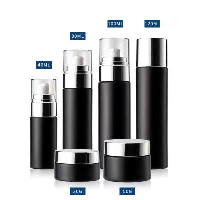 China Luxury Round Black Cosmetic Glass Container 100ml 30ml 50ml Serum/Cream Glass Cosmetic Container Jar Bottle With Lid for sale