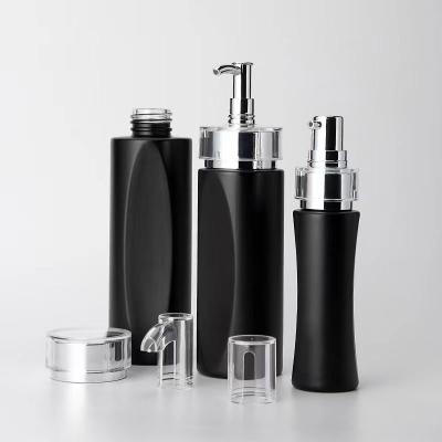 China High Quality Luxury Cosmetic Set Packaging Pump Glass Bottle Set With Shiny Silver Cap for sale