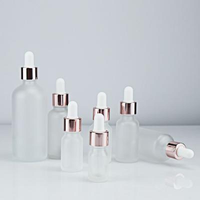 China High Cost Effective Personal Care Essential Oil Glass White Dropper Bottle Set With Rose Gold Dropper Cap for sale