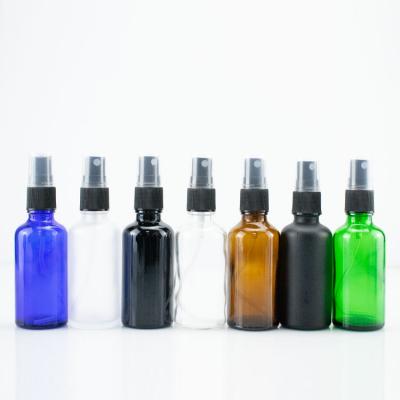 China Cosmetic In Stock 50ml Amber Glass Spray Bottle Empty Essential Oil Glass Bottle With Plastic Atomizer Pump for sale