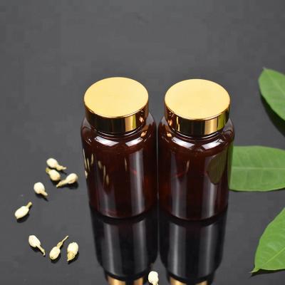 China Recyclable Custom Embossed Logo 150ml Pharmacy Amber Pill Bottle With Gold Cap for sale