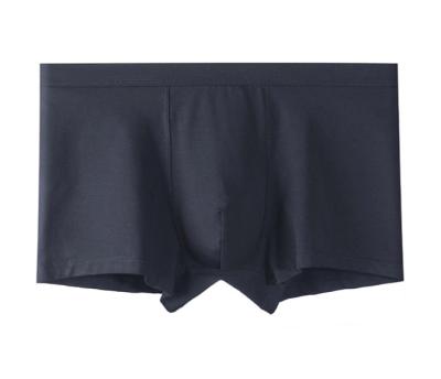 China New Breathable Men's Sexy Boxer Shorts Stretch Tight Mid Waist Solid Color Seamless Panties for sale