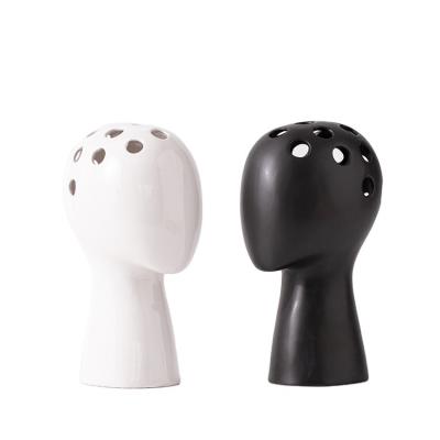 China Modern Design Sculpture Face Hand Grouting And Glazing Human Head Vase Matte Irregular Ceramic Vase Home Decor Wholesale Accessories for sale