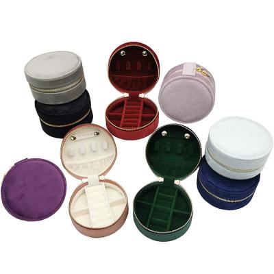 China Sustainable Travel Velvet Jewelry Box Zipper Round Shape Jewelry Case For Rings Bracelets Earrings Storage for sale