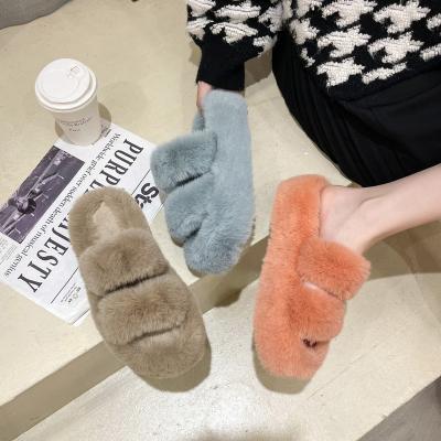 China Wholesale Winter Pink Fuzzy Slippers Fashion Trend Faux Fur Flat Indoor Home Thick-soled Slippers For Women for sale