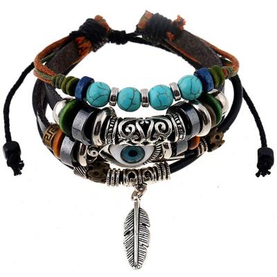 China FASHIONABLE Feather Pendant Cowhide Beaded Bracelet Braided Leather Devil's Eyes Bracelet Ornaments Wholesale for sale