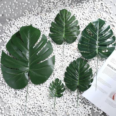 China Good Quality Plastic Artificial Tropical Leaves Metal Cloth Green Turtle Plam Grow Leaves Artificial Leaves For Decoration for sale