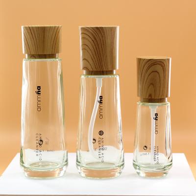 China Cosmetic green or other color wholesale custom cosmetic lotion glass bottle with pump for sale