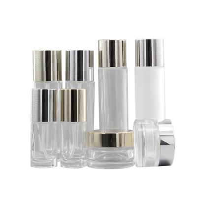 China Custom clear luxury empty cosmetic high quality cosmetic packaging lotion glass bottle with pump for sale