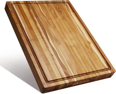 China Viable Large Teak Wood Cutting Board For Kitchen Reversible Wooden Chopper With Juice Grooves Handles Ideal For Cutting Meat for sale