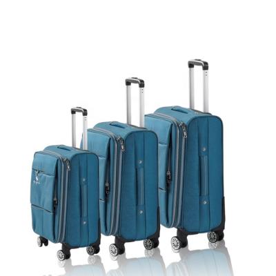 China Free Sample Premium Polyester 600d Polyester Eva Trolley Patriot Wheels Luggage Bag for sale