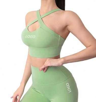 China Kd0919 Breathable Pure Color Women Sports Bra Strappy Underwear Bare Cross Vest Pants Running Fitness Bra for sale