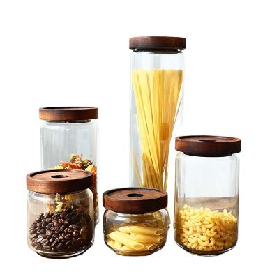 China Household Kitchenware Glass Storage Stocked Jar With Wooden Lid for sale