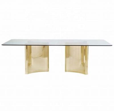 China Traditional modern luxury gold stainless steel dining table with glass top for sale