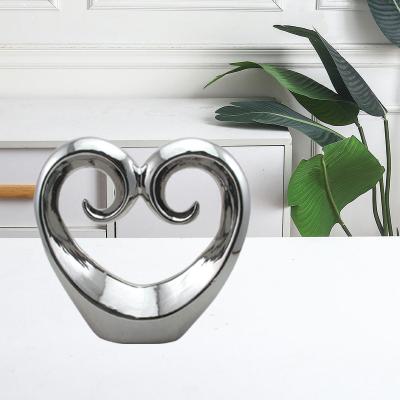 China Ceramic ware hot sale hollowed-out heart silver porcelainous home decoration pieces for sale