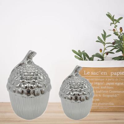 China Christmas Ceramic Traditional Item Ceramic Nut Shape Silver Jar For Home Decoration for sale