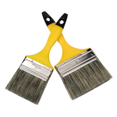 China Professional design of white paint and black bristle mixed with yellow plastic filament handle with black top brush for sale