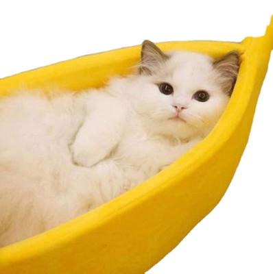 China Creative Pet Warm Nest Cotton Cartoon Cat Dog Banana Shape Portable Heating Bed Shaped Autumn Winter Warm Indoor for sale