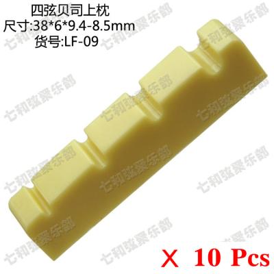 China Plastic 10 Pcs Yellow Plastic 4 String Electric Bass Guitar Nuts sIze=38 x 6 x 9.4-8.5mm (LF-09-YE-10) for sale