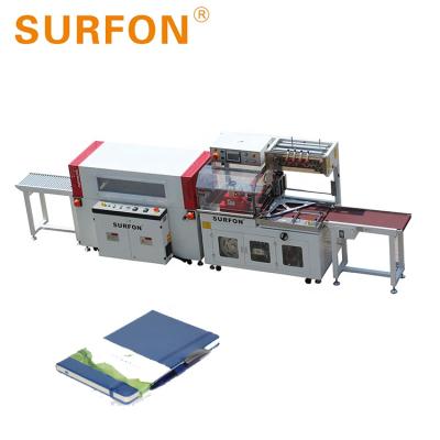 China Automatic CLOTHING Notebook Shrink Film Machine Factory For Wooden Panels for sale