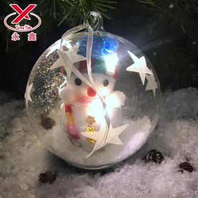 China Christmas Decoration Ensures Christmas Lead Glass Ball With Hat Snowman Light Up Glass Ornament for sale