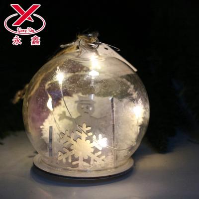 China Christmas Decoration Supply Lead Glass Snowball Light Up Glass Ornament for sale