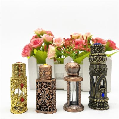 China Custom Luxury Metal Cavity Personal Care 10ml 15ml Cylindrical Perfume Glass Bottle From Factory for sale