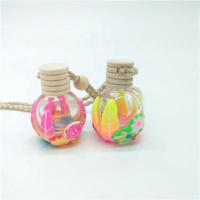 China Personal Care Wholesale 13ml Clear Empty Ball Shape Car Perfume Glass Hanging Bottle Mini Auto Vent Scent Blank Cover Wooden Clamp Fragrance for sale