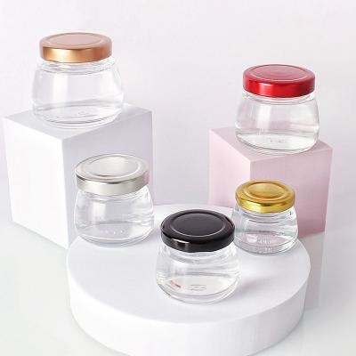 China Luxury Glass Honey Bottle Food Grade Food Jam Spice Storage Jar 30ml 40ml 50ml 80ml 100ml Mini Bird Nest Design Clear With Metal Lids for sale