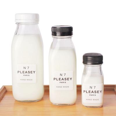 China Wholesale 100ml/300ml/500ml/1000ml Eco-friendly Recyclable Square Clear Square Beverage Glass Bottle For Tea Juice Milk Glass Bottle With Screw Top for sale