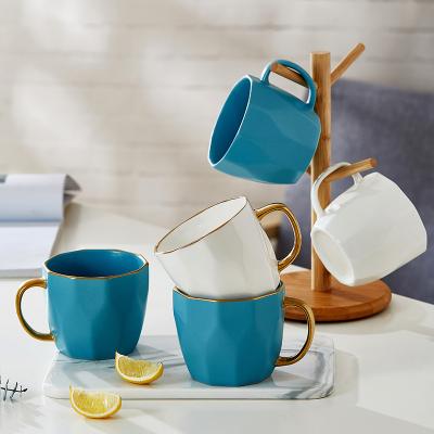 China Viable Nordic Light Luxury White Ceramic Mug With New Handle Bone China Gold Blue Mug Ceramic Bulk Mugs for sale