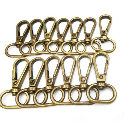 China Bag Accessories REWIN Wholesale Anti Rust Solid Metal Snap Antique Brass Buckle For Bag Strap Accessories for sale