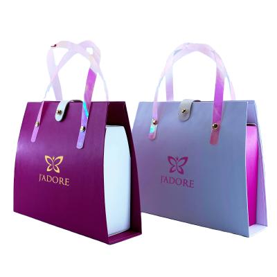 China Recyclable Custom Fancy Pink Handle Cardboard Boxes Folding Gift Box With PU Belt Buckle Closed For Hair Wig Hair Extension Box for sale