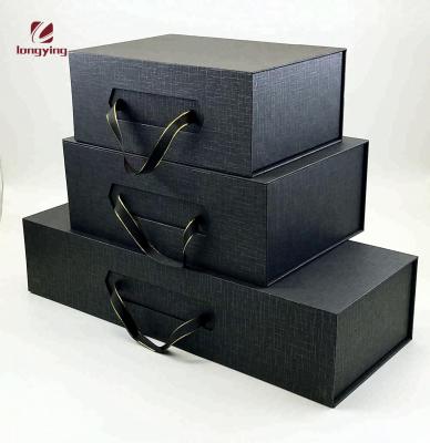 China Hot Sale Custom Made Luxury Matte Black Magnetic Paper Flip Top Box With Ribbon Handle For Shoes Packaging Box for sale