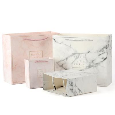 China Recycled Materials Custom White Printing Card Marble Shopping Paper Gift Packaging Bag for sale