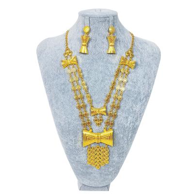 China 2021 Fashion New Dubai Newest Design Bowknot Style Long Zinc Alloy Necklace 24k Wedding Jewelry Set for sale