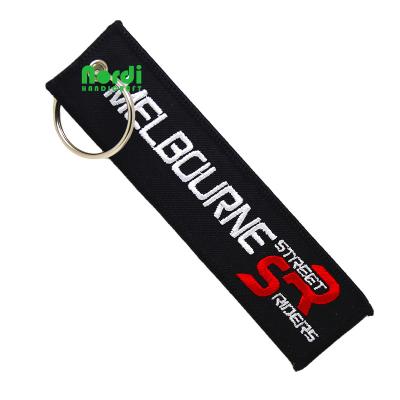 China Custom Apparel Embroidery Hot Selling Key Chain Embroidered Key Indicator Spray Tag For Airplane/Motorcycle for sale