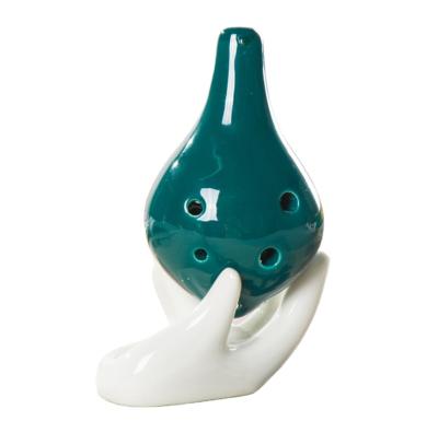 China Trendy Modern Custom Colored Ceramic Ocarina With Supporting White Hand for sale